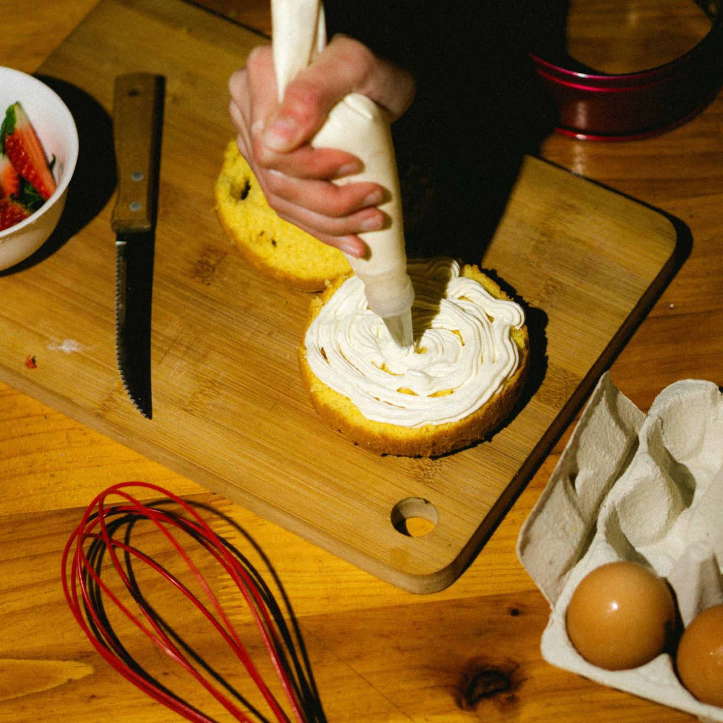 Community members collaborating in a modern kitchen space, sharing recipes and cooking techniques